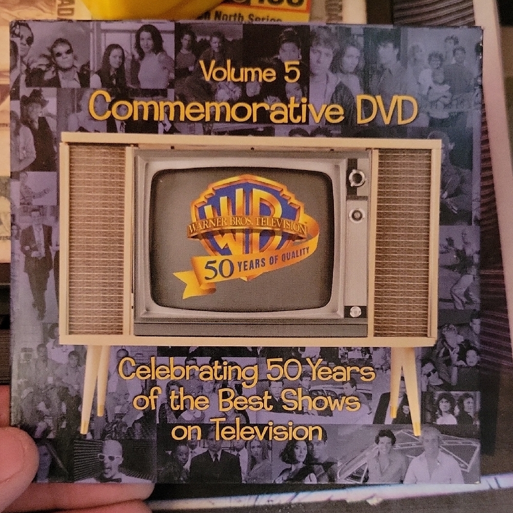 Warner Bros. Commemorative DVD with Gold and Gray Design